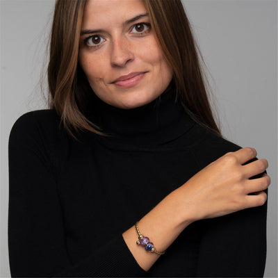 Csavart aranyozott karperec 2 x arany spacerrel